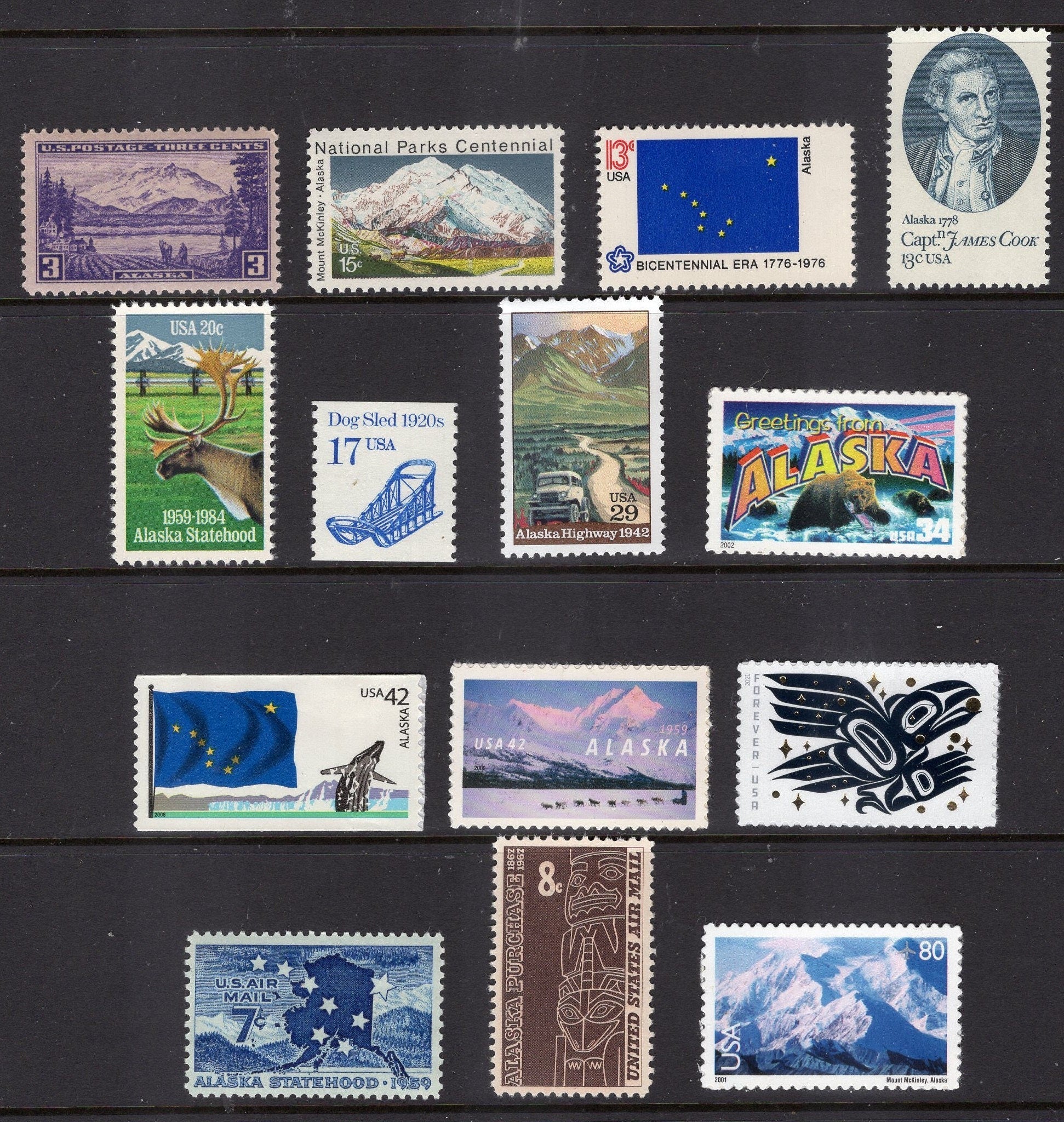 ALASKA COLLECTION #1 - 14 with Alaskan Scenes, Raven Story, State Flag, Mt McKinley, Cook, Dog Sled